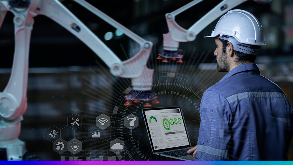 Indústria 4.0 com trabalhador monitorando robôs industriais e analisando dados em laptop, simbolizando automação e transformação digital no setor industrial.